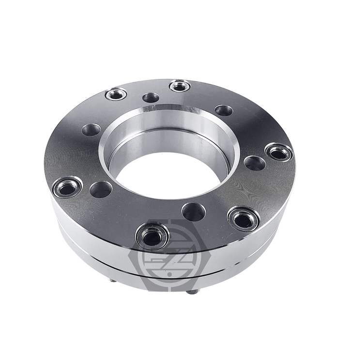The Hub Centric Wheel Adapter 5x5.5 to 8x170, with a 2 thickness, is CNC machined from metal, featuring multiple bolt holes and a hollow center. Its shiny and smooth, designed to convert from 5 lug to 8 lug with precision engineering in mind.