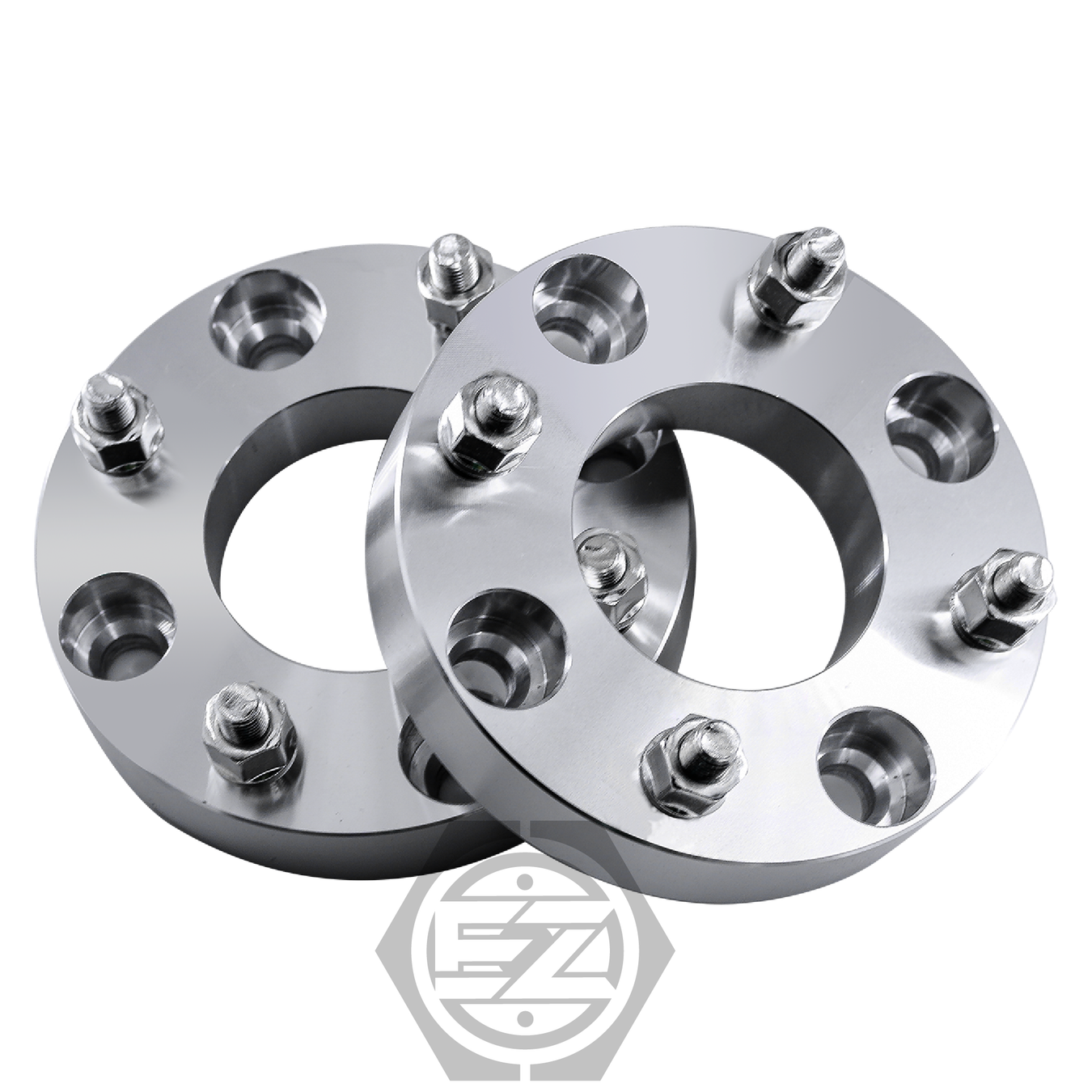 Two circular ATC Wheel Adapters made from CNC machined billet aluminum sit on a white background. Each premium adapter showcases an engraved hexagonal logo, with a 4 lug 136mm bolt pattern, angled to highlight depth.