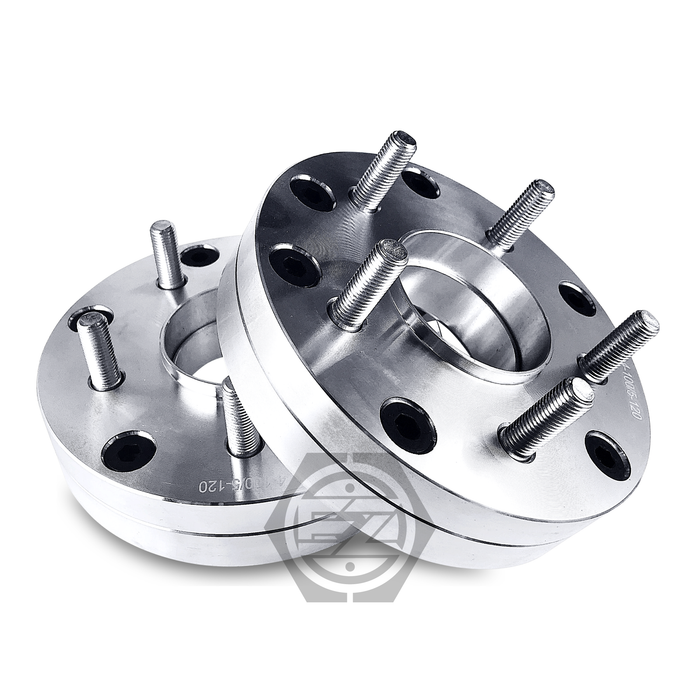 Two Hub Centric Wheel Adapters, each 1.5 thick, are slightly angled showcasing multiple bolt holes for a 4x100 bolt pattern against a white backdrop.