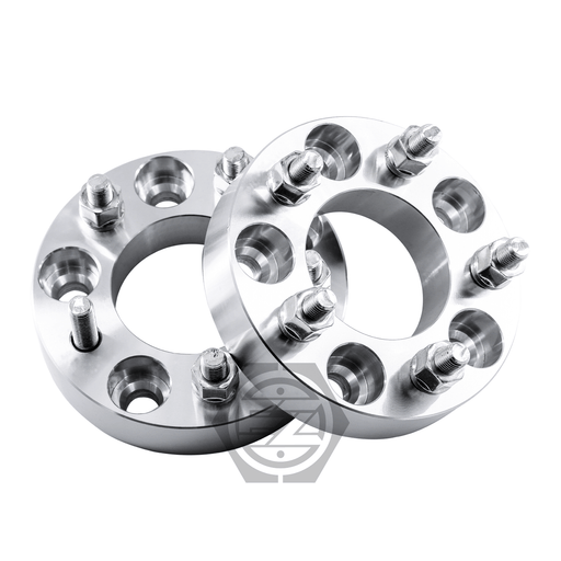 A pair of Wheel Adapters 5x112 to 5x112 made from billet aluminum are displayed side by side, featuring multiple bolts and a brand logo on one adapter. Their shiny, polished finish gleams under the light.