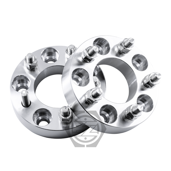 A pair of Wheel Adapter 5 Lug 4.5 to 5 Lug 100, silver CNC machined aluminum with multiple stud holes, lies slightly overlapping on a white background. The circular spacers with protruding bolts indicate their function as adapters for bolt pattern wheels.