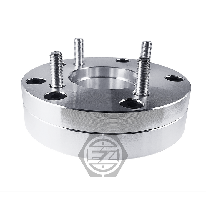 A Wheel Adapter 5 Lug 4.5 To 4 Lug 100 Thickness 1.75 features a shiny silver finish, branded logo etching, four protruding threaded studs, and multiple bolt holes for seamless conversion of 4x100 wheels to a five-lug pattern.
