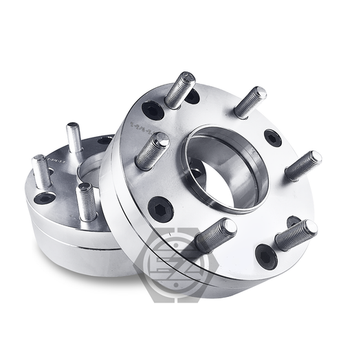 Two hub centric wheel adapters, expertly crafted from billet aluminum with multiple bolts and circular holes, are stacked on a white background. The top one is angled left, showcasing thickness and design details. Product: Hub Centric Wheel Adapter 5x4.5 To 6x5.5 Thickness 2 (Pair).