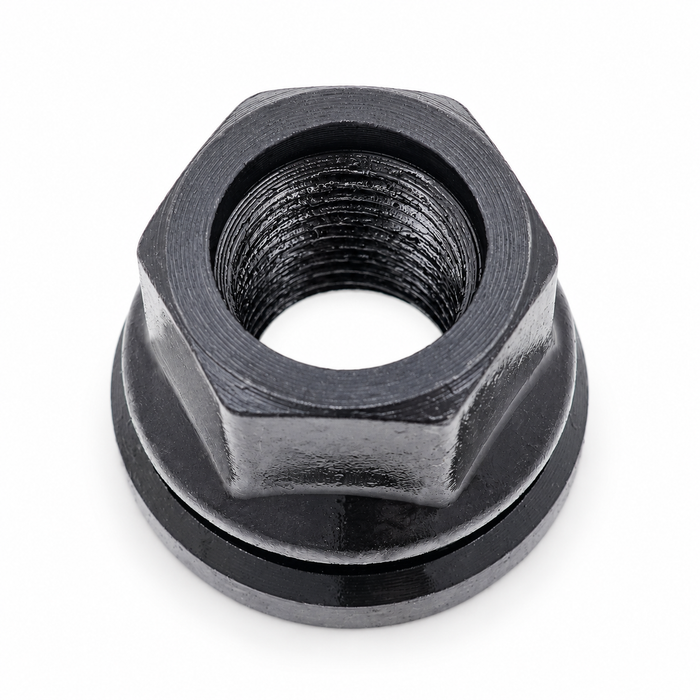 Dark gray 1/2-inch lug nut for Ford with an open threaded center, hex body and broad attached washer.
